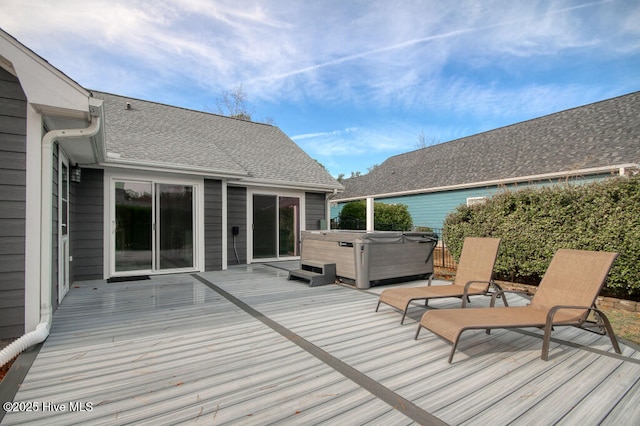 wooden terrace with a hot tub