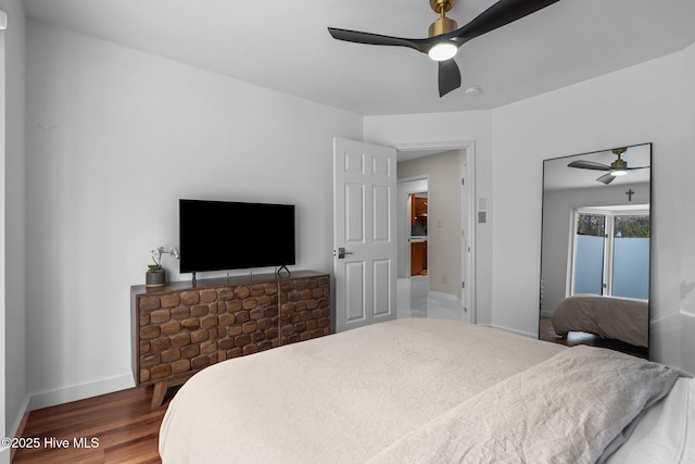 bedroom featuring ceiling fan and wood-type flooring