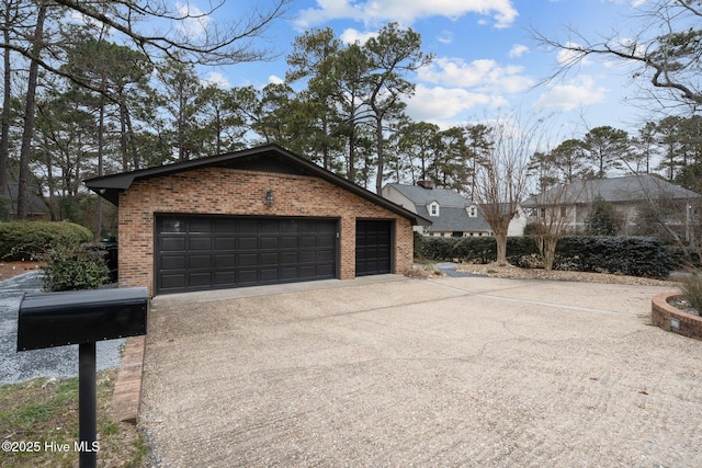 view of side of home with a garage and an outdoor structure