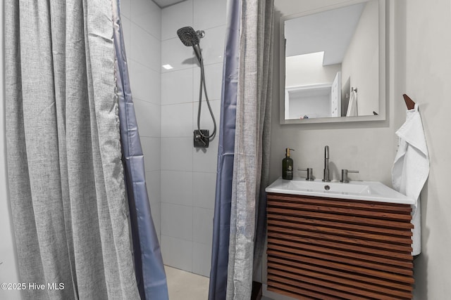 bathroom featuring vanity and a shower with shower curtain