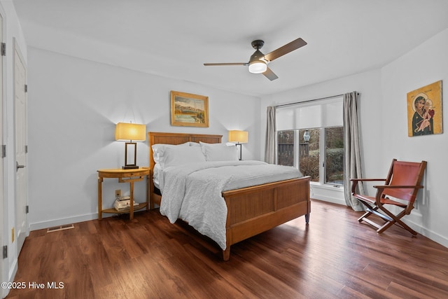 bedroom featuring dark wood-type flooring and ceiling fan