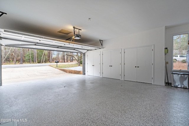 garage featuring a garage door opener