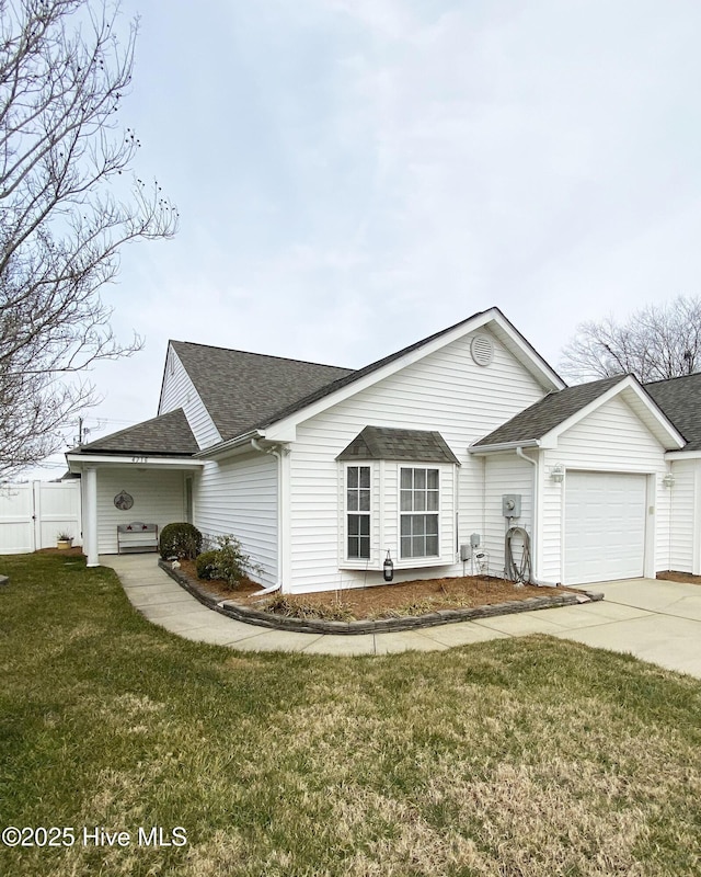 single story home featuring a garage and a front yard