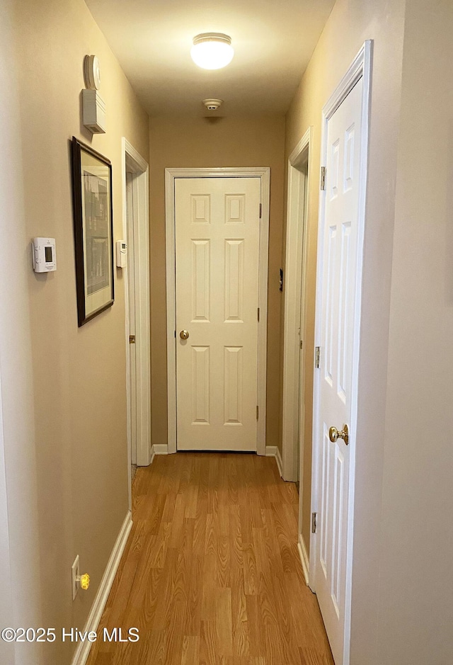 corridor featuring light wood-type flooring