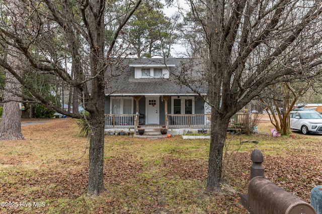 view of front of house featuring a front yard and a porch