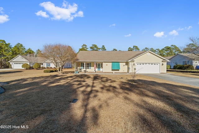 single story home featuring a porch and a garage