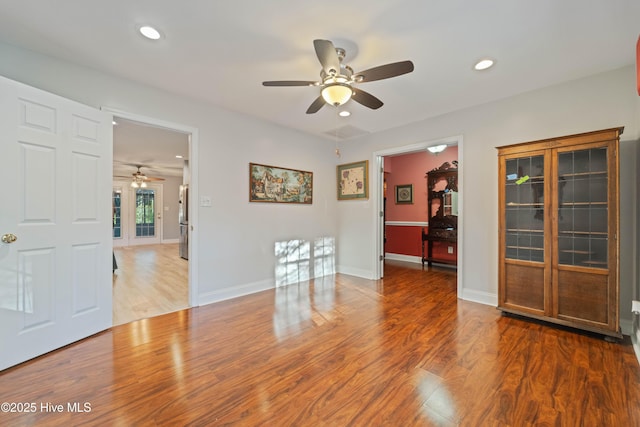 spare room with hardwood / wood-style floors