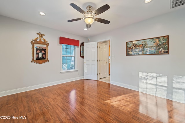 unfurnished room featuring ceiling fan and light hardwood / wood-style flooring