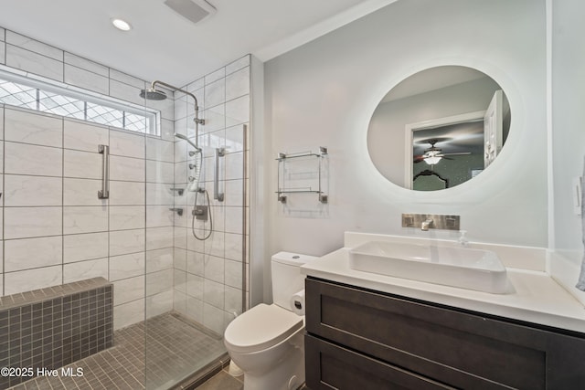 full bath with vanity, visible vents, recessed lighting, a shower stall, and toilet