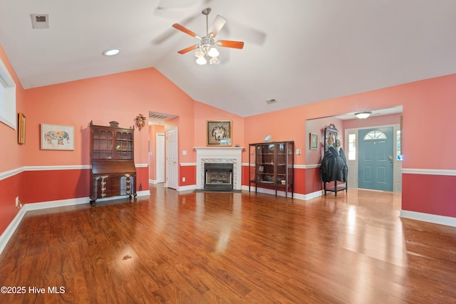 unfurnished living room featuring ceiling fan, hardwood / wood-style floors, and lofted ceiling