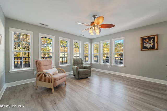 sitting room with a healthy amount of sunlight and light hardwood / wood-style flooring