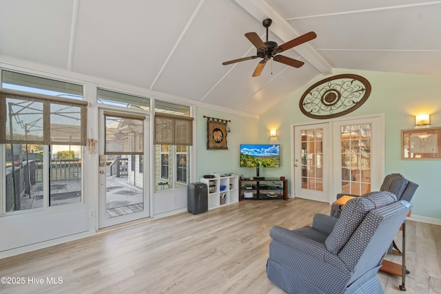 sunroom with vaulted ceiling with beams, ceiling fan, and french doors