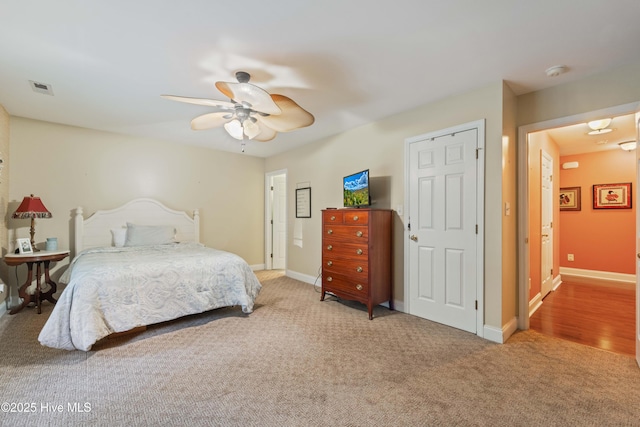 bedroom with ceiling fan and carpet