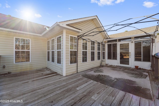 wooden terrace with a sunroom