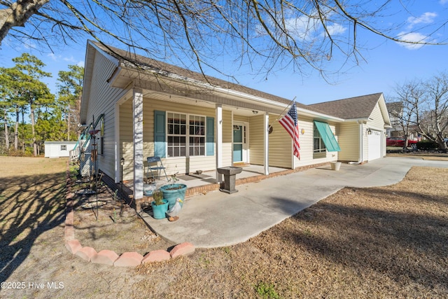 ranch-style home with a garage and covered porch