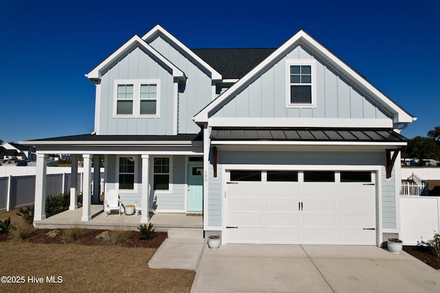 view of front facade with a garage and a porch