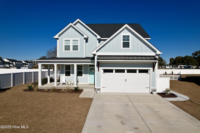 view of front of home featuring a garage and covered porch