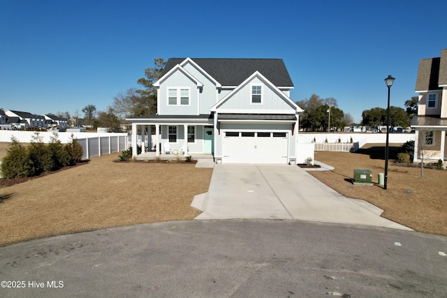 view of front property with a garage and covered porch