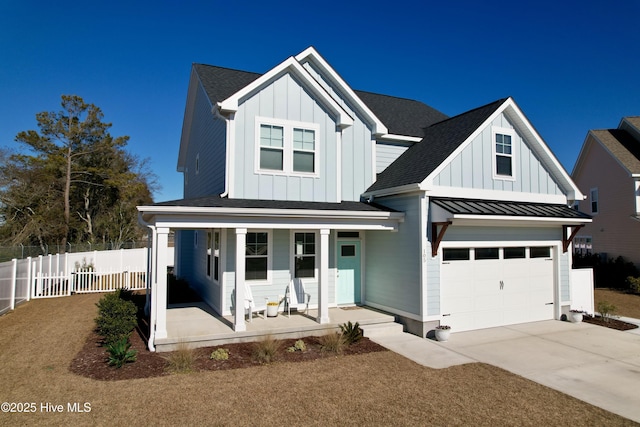 view of front of property with a porch and a garage