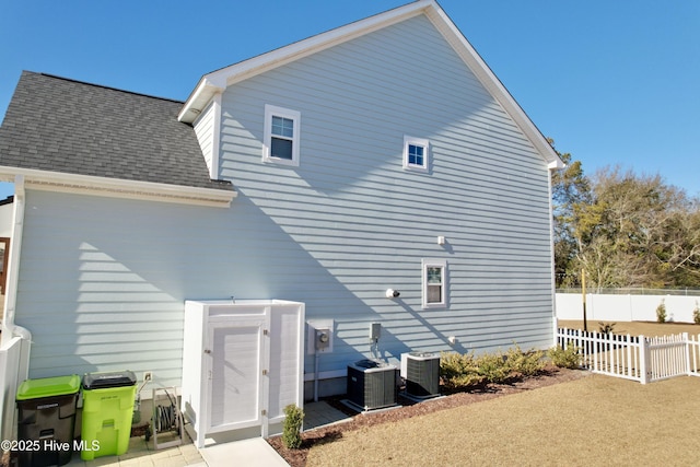 back of property with central air condition unit