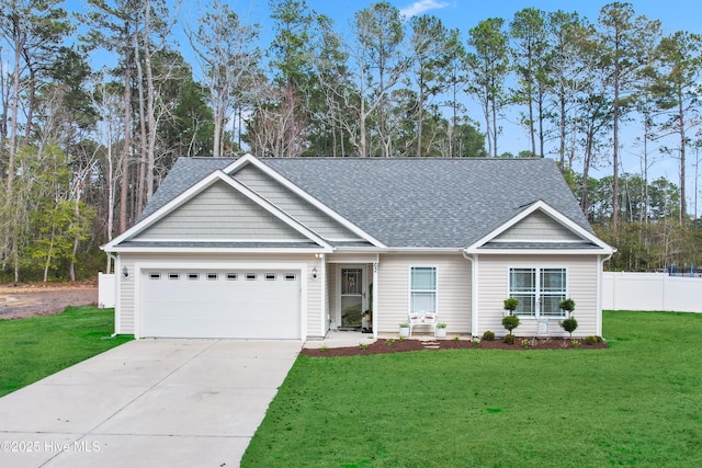 single story home featuring roof with shingles, concrete driveway, an attached garage, a front yard, and fence