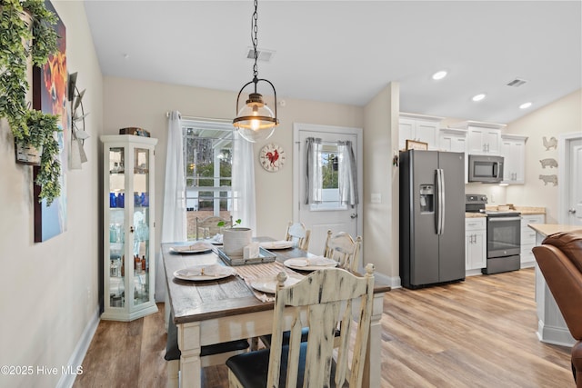 dining area featuring light hardwood / wood-style flooring