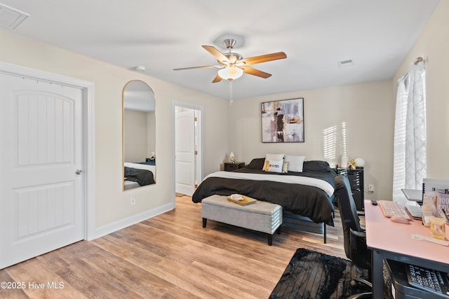 bedroom with light hardwood / wood-style flooring and ceiling fan