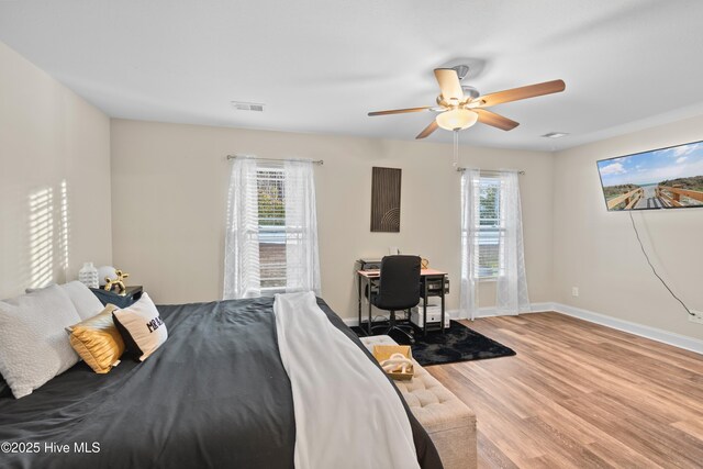 62 NE Dr NW, Calabash, NC 28467 - bedroom featuring wood finished floors, baseboards, a ceiling fan, and an office area