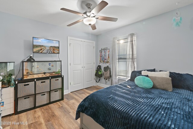 bedroom with ceiling fan and wood-type flooring