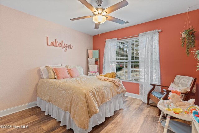 recreation room with wood-type flooring and ceiling fan