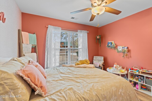 recreation room featuring hardwood / wood-style flooring and ceiling fan