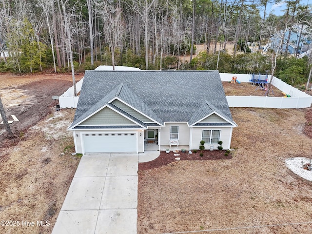 62 NE Dr NW, Calabash, NC 28467 - view of front of home with a shingled roof, a garage, and driveway