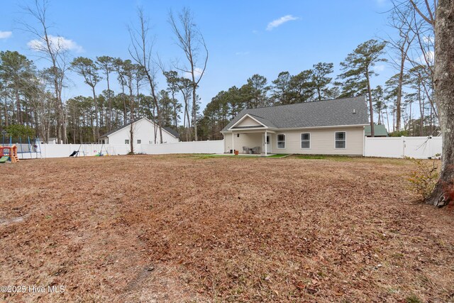 view of front facade with a patio area and a front lawn