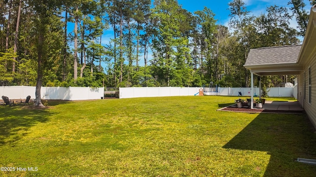 62 NE Dr NW, Calabash, NC 28467 - view of yard featuring a patio