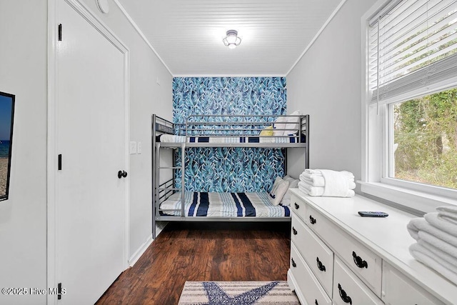 bedroom featuring dark hardwood / wood-style floors and ornamental molding