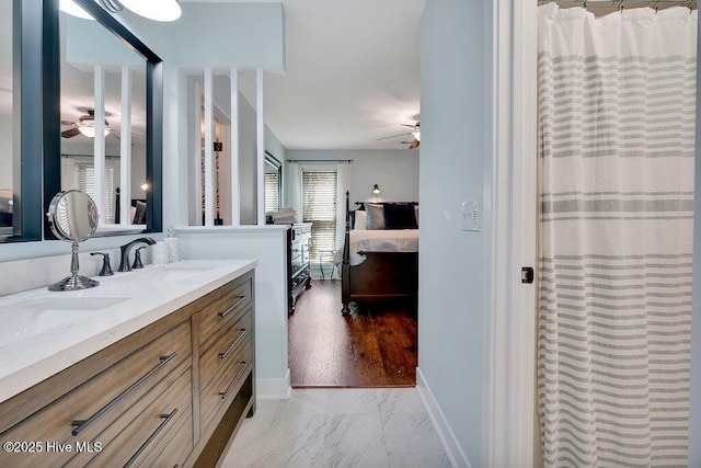 bathroom with ceiling fan, vanity, and a shower with curtain