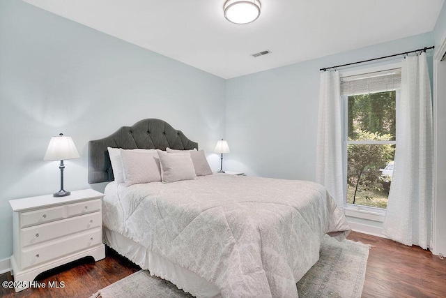 bedroom featuring dark wood-type flooring