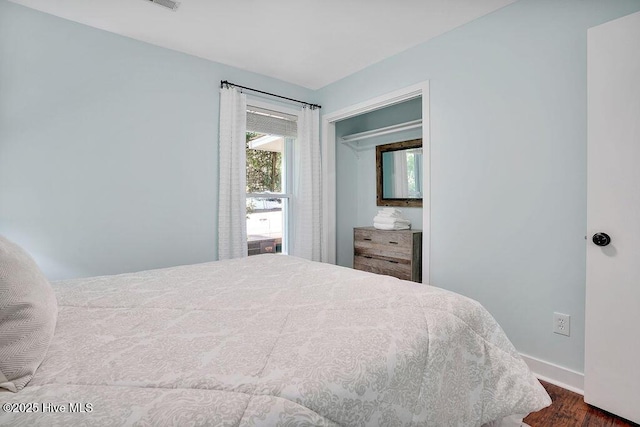 bedroom featuring dark hardwood / wood-style floors