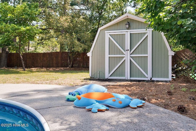 view of outbuilding featuring a lawn