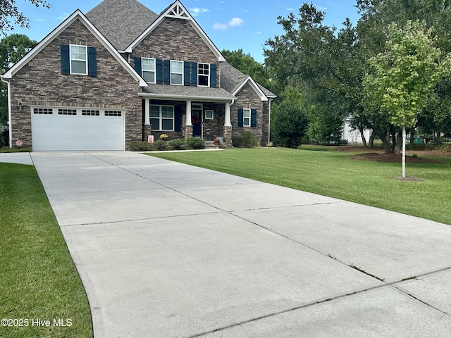 craftsman-style house featuring a garage, a porch, and a front yard