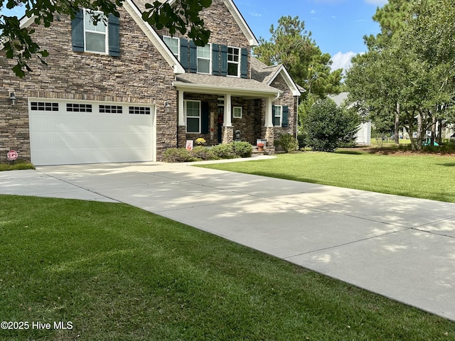 view of front of property with a garage, covered porch, and a front yard