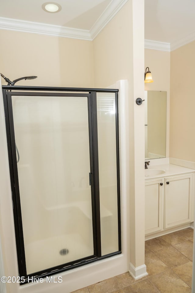 bathroom featuring an enclosed shower, vanity, and crown molding