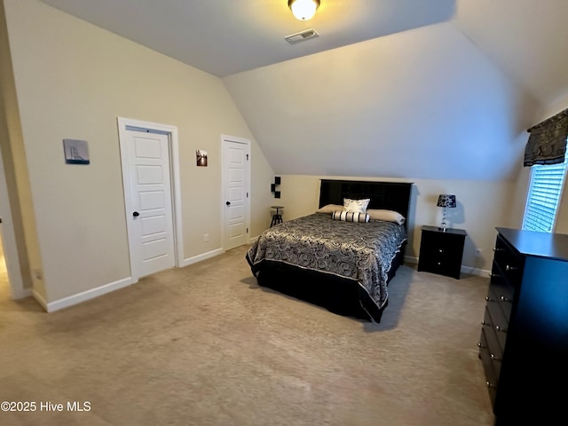 bedroom featuring carpet flooring and vaulted ceiling