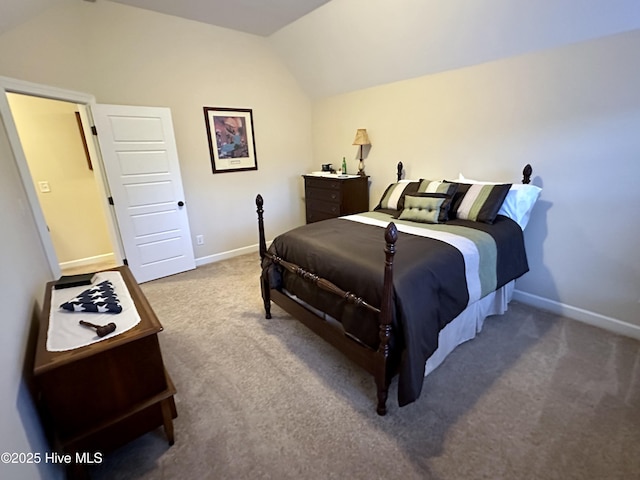 bedroom with carpet and lofted ceiling