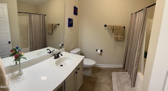 full bathroom featuring vanity, shower / bath combination with curtain, and toilet