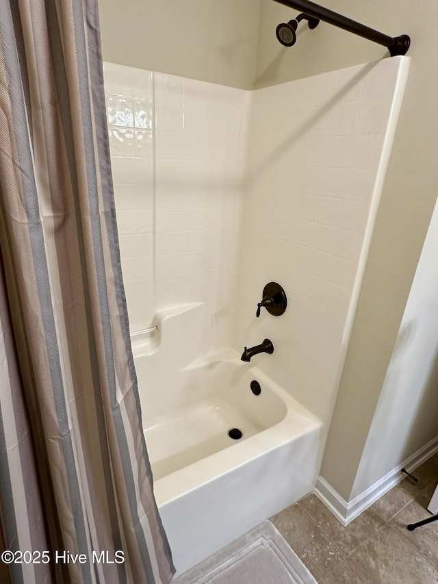 bathroom featuring tile patterned flooring and shower / tub combo