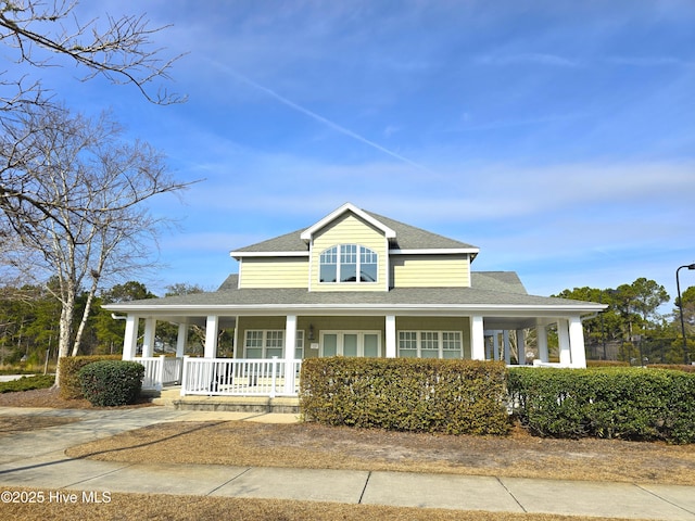 farmhouse inspired home featuring covered porch