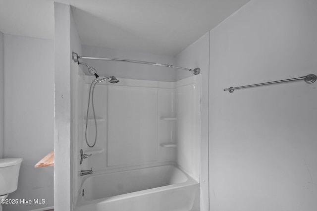 bathroom with toilet and shower / washtub combination