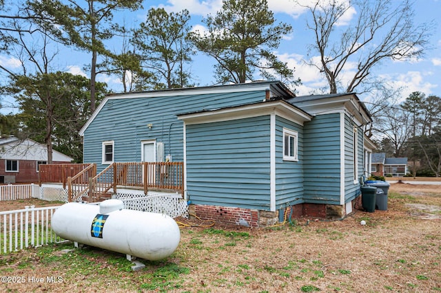 rear view of property with a deck