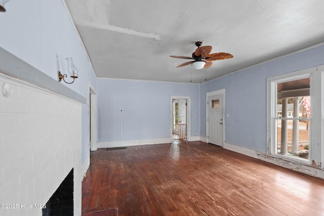 unfurnished living room with ornamental molding, ceiling fan, and hardwood / wood-style floors